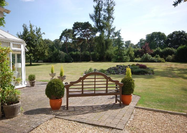 The boundaries of the property are well fenced and also screened by mature trees and hedging and lawn areas.