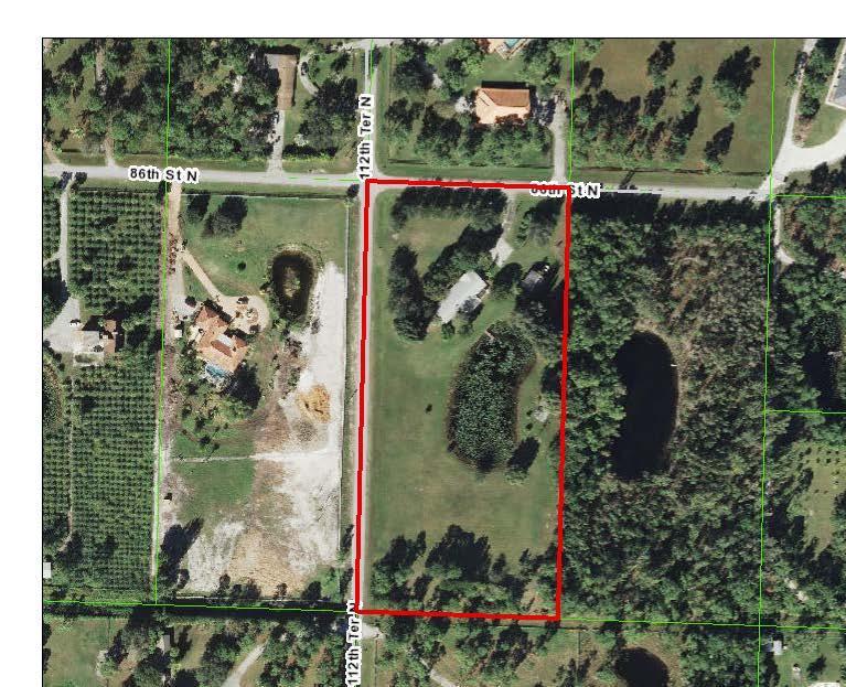 STAFF SUMMARY FIGURE 1 AERIAL This property is located approximately.467 miles south of the intersection of Northlake Blvd and 112 th Terrace North in the Rustic Lakes Subdivision.