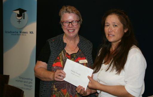 Phd Student Supervisors Jenny Rodgers (left) and don't know (right) collect cheques from Felicity Farrelly on behalf of their winning students.