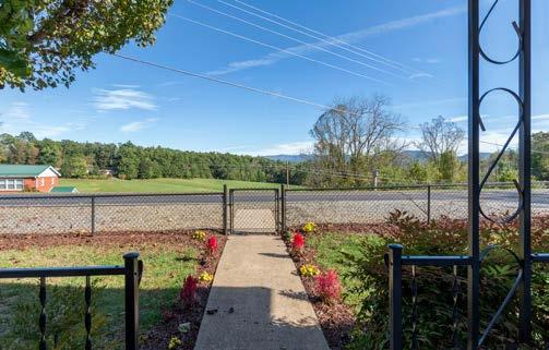 Take in long-range mountain views from covered front porch, or unwind on the large back deck.