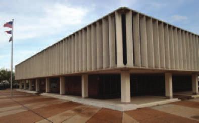 The overall feel of the Modernistic style is massive, with weighty concrete and textured surfaces. In this case, the texture extends to the entire courthouse grounds.