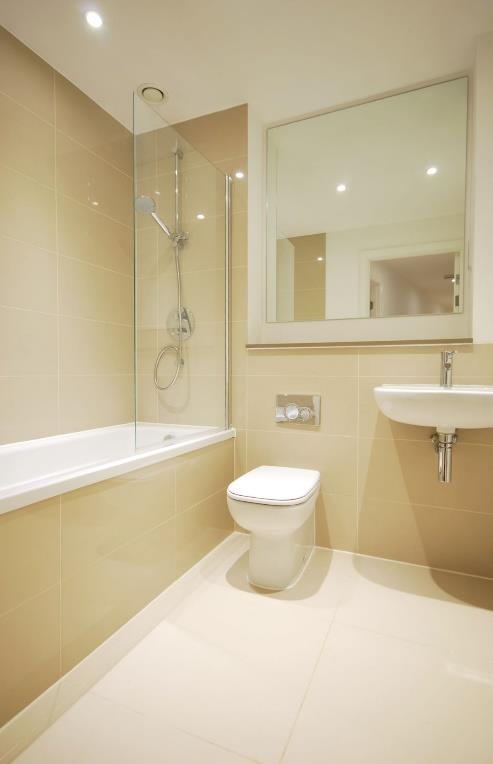 FAMILY BATHROOM 6 10 x 5 6 max. Single panel bath unit with mains shower, riser bar, hose and head. Glass shower screen.