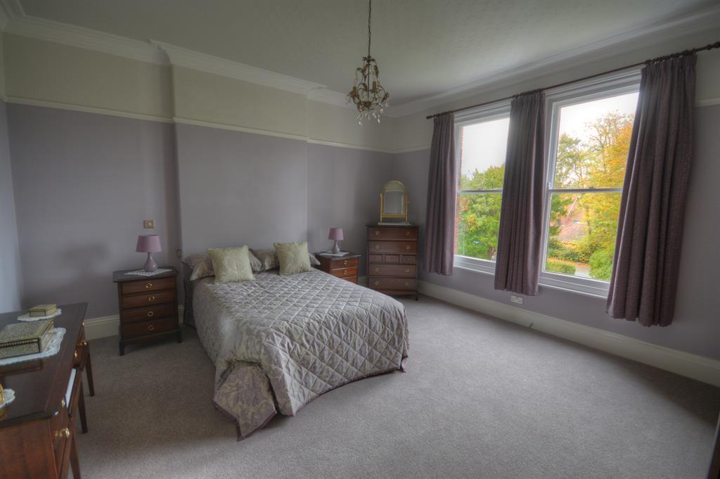 30m (30' 6") Large bay window to the front aspect and windows to the side and rear aspect, ornate coving and ceiling with two ornamental ceiling roses with centre lights, two inset feature niches,