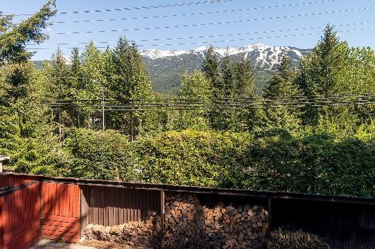 minutes walk from esters' Square, sits a small home on a flat sunny 7,684 sf lot with Whistler/Blackcomb Mountain views that is perfect