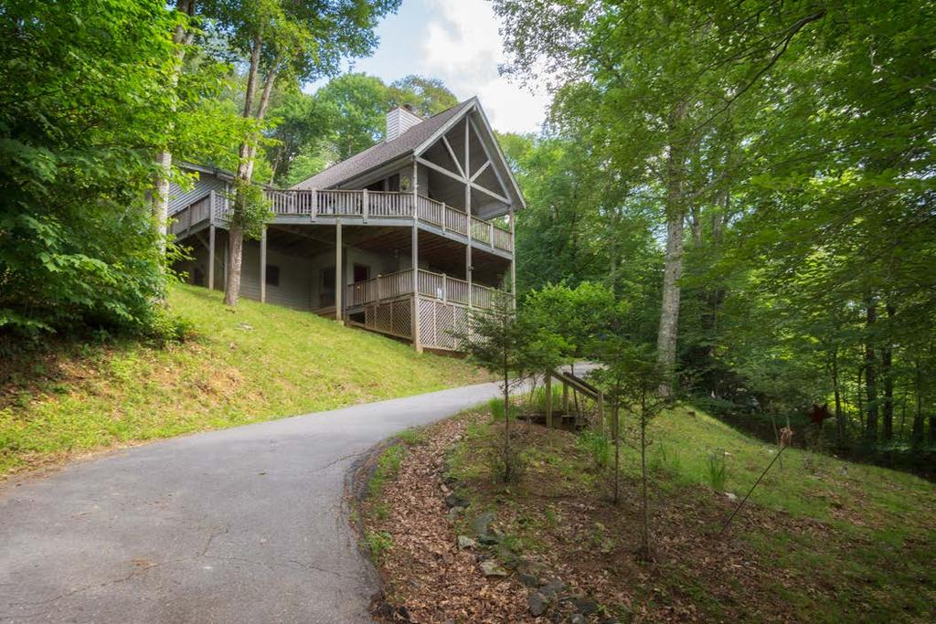Wander to Wolf Laurel and live among 5,000 acres of natural beauty in this spacious, stylish, and serene forested mountain home.