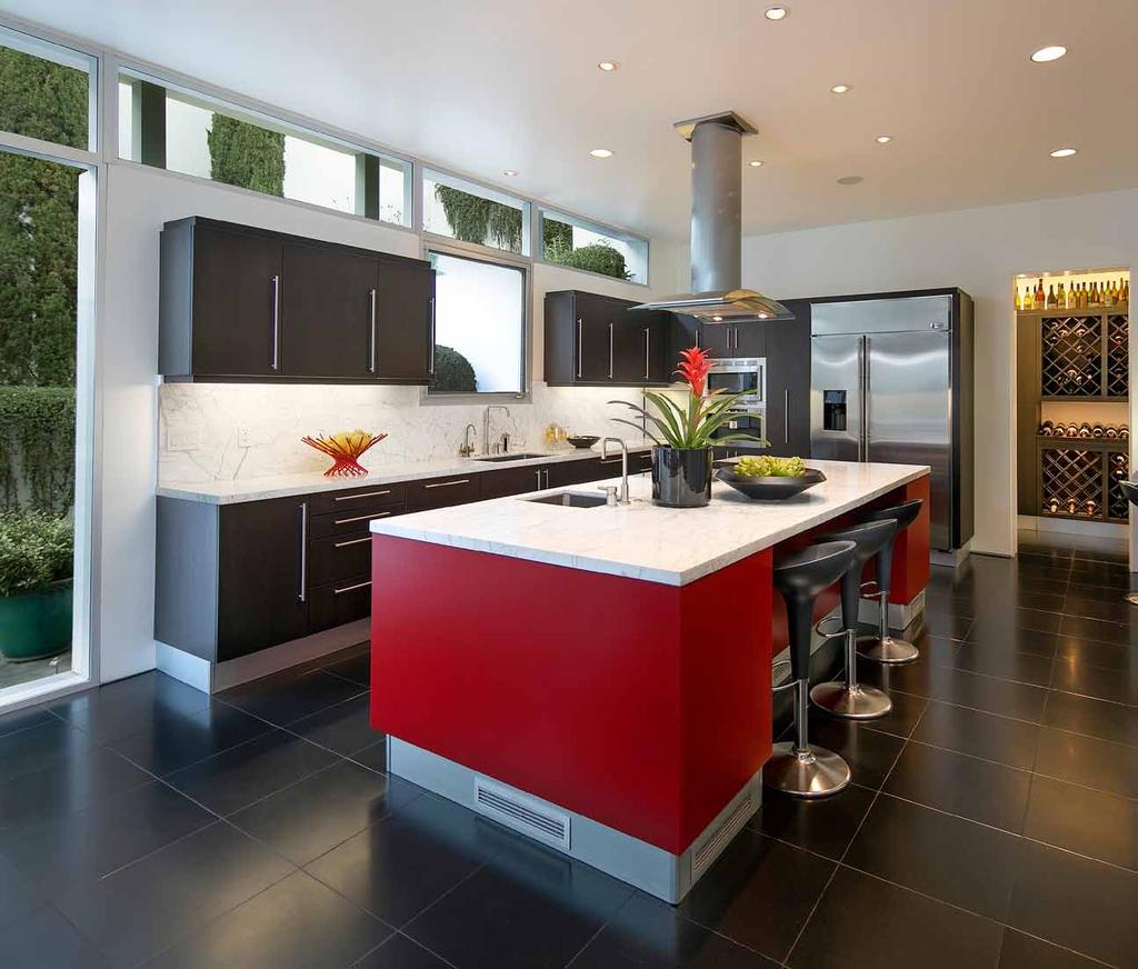 The stunning contemporary kitchen is accessed from the dining room or entry gallery and can be closed off with pocket doors.