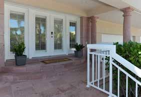 FOYER Size: 14 3 x 11 4 Full-light, double entry doors with side lights and wood Plantation shutters