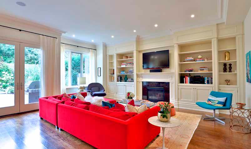 MAIN FLOOR Family Room Custom built-in wall-to-wall shelves and cabinetry Gas fireplace with granite