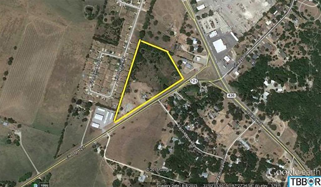 LAND $752,880 901 E. LOOP 121 From IH 35 go East on Loop 121, just past the storage facility on left has old house on site.