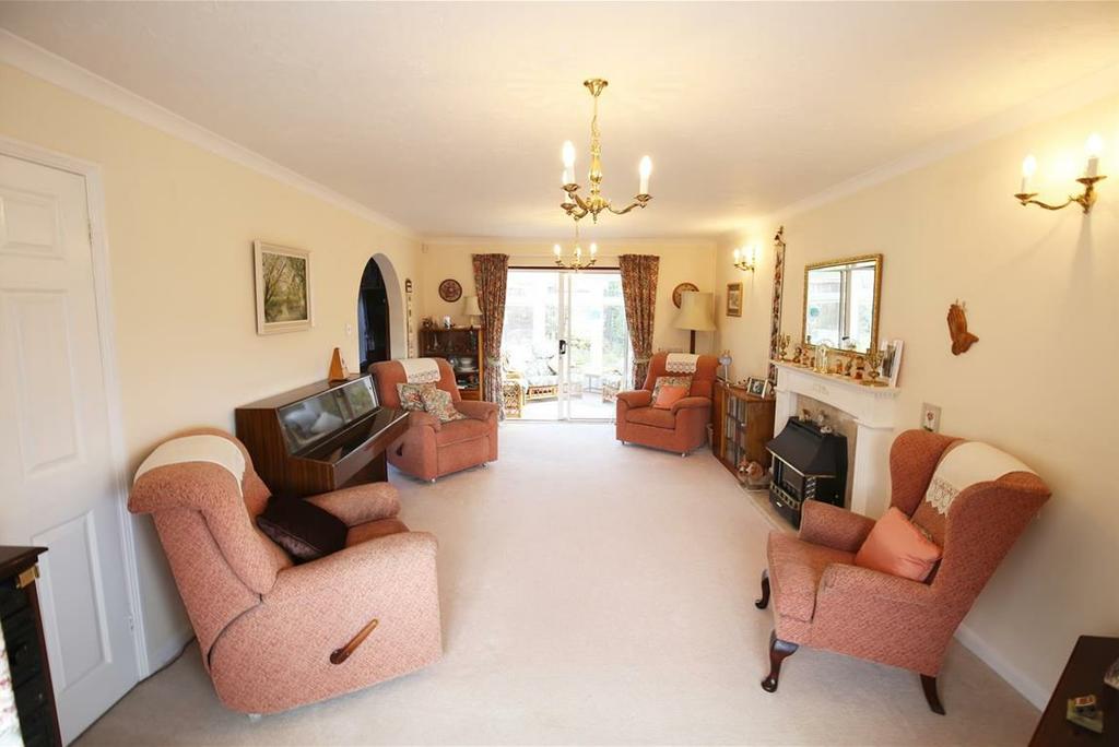 53m ) A spacious, light and airy front to back living room, with a large upvc double glazed bay fronted window looking