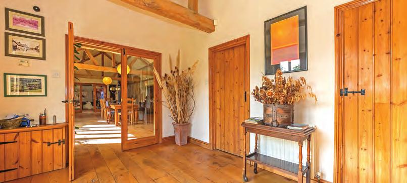 Step inside River Quin Barn The front door opens into a bright and inviting hallway with exposed brickwork and timbers that are a common theme throughout the extensive accommodation of River Quin