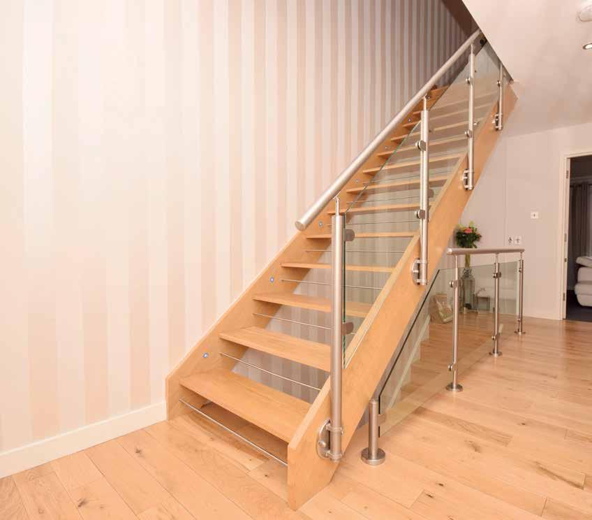 Oak staircase to the first floor landing with large cupboard and two further press cupboards.