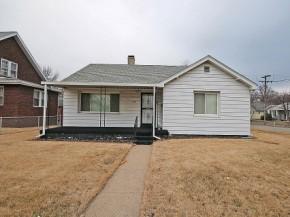 three bedrooms, gorgeous kitchen, (appliances negotiable), newer siding, roof, water heater, porch, replacement windows.