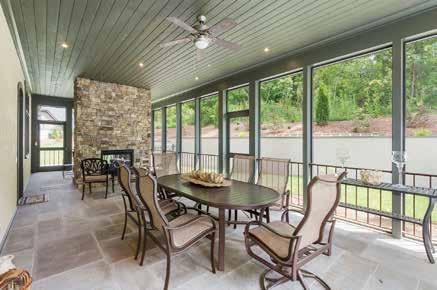 Perfect for entertaining with an amazing stone tiled outdoor screened patio including a double-sided fireplace accessible from multiple rooms in the home Oversized windows for great natural light
