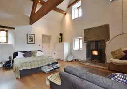 There are exposed ceiling beams, wattle and daub to one wall, a period fireplace (not used) which is a character feature of the room.