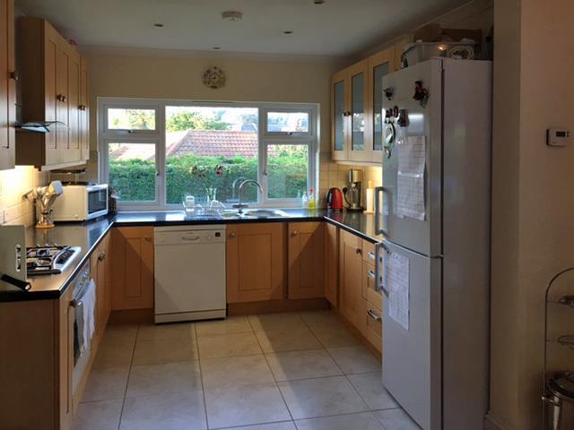 Kitchen 9 8 x 9 8 Fitted with a range of light wood units with granite effect work surfaces incorporating 1½ bowl
