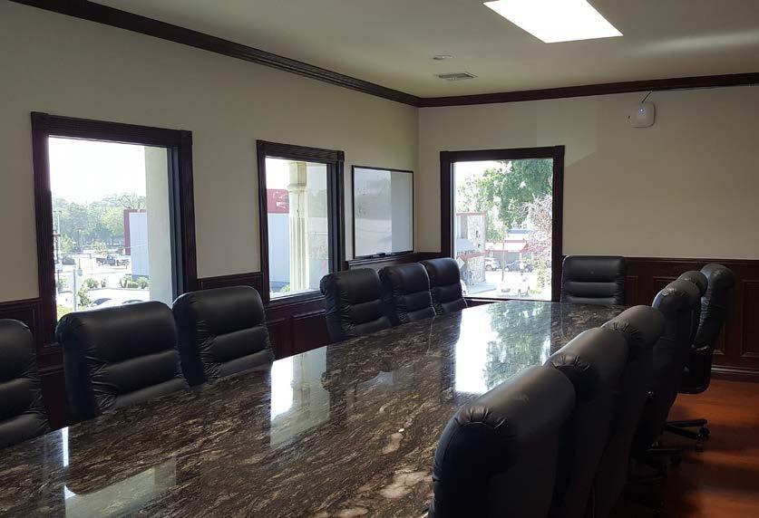 Superior Condition High-Visibility Trophy Building Luxurious Interior Updates: Wrought Iron Staircase, Oversized Granite Conference Table, Marble Countertops, Hardwood and Ceramic Tile Floors, Crown