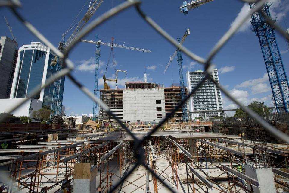 Page 1 of 5 Miami-Dade County JULY 1, 2015 Property values in Miami-Dade up higher than expected This May 30, 2014 photo shows the construction of buildings in Miami s downtown financial district of