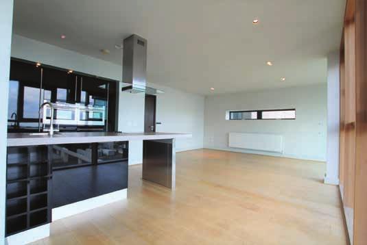 The interior is fresh and inviting and is finished to an exacting standard throughout including a modern fitted black gloss kitchen, oak wooden flooring throughout and features an end of block