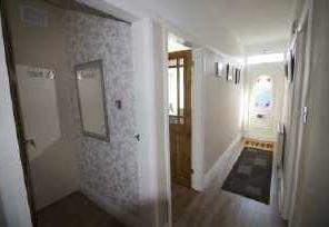 ENTRANCE DOOR Entrance Upvc door leading to: 46 Heathfield Road, Huddersfield HALLWAY Reception hallway which gives access to all rooms, there is a gas central heating radiator, and access to the