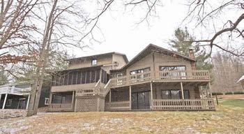 floor master suite with large bath, finished walkout lower level with family room, home office space, full bath and 4th bedroom, expansive rear deck and lower level patio, nice boat dock with