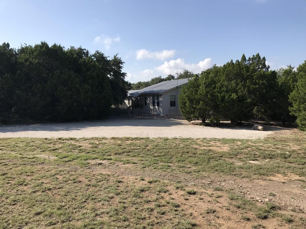 Executive Summary PROPERTY OVERVIEW Beautiful unrestricted 5 acre Hill Country property with FM 306 frontage, between two access roads to Canyon Lake, 4 miles to shopping, 9 miles to Hwy 281, 18
