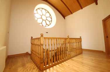 Accommodation Feature Upper Hall Double access staircase with balustrades, staircase well and original stunning circular stained glass window High vaulted ceiling Hatch with