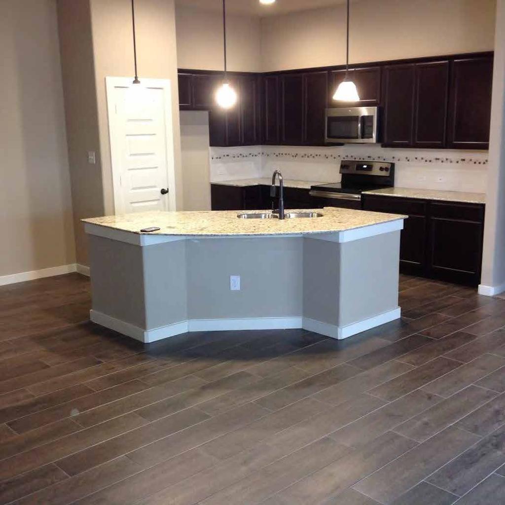This side of the duplex features a newly designed kitchen and