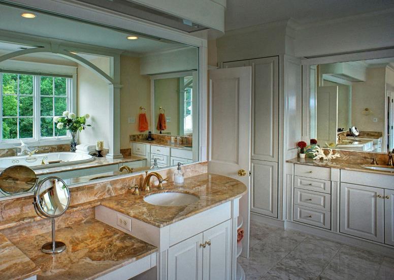 raised marble vanities, make-up niche; linen closet; recessed lights; jetted tub