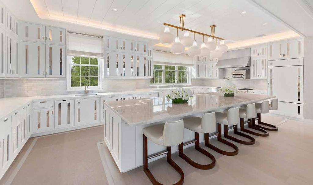 This brand new, custom transitional estate was just listed after 3 years of designing and building, with a traditional Hamptons shingled exterior and totally modern interiors magnificently, designed