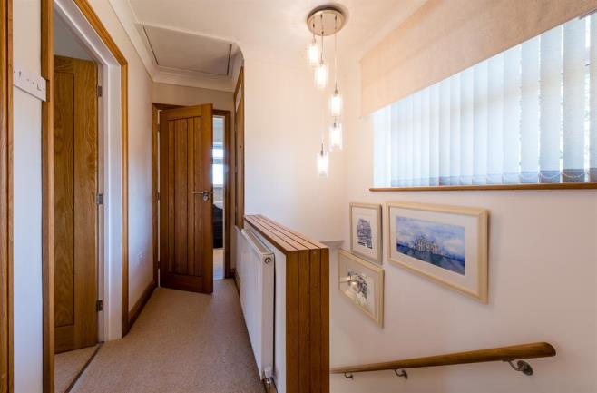 50m (14' 9") With a door leading from the hall this stunning re fitted kitchen breakfast room has a range of high gloss and soft closing white and cappuccino wall and base units, work surfaces with