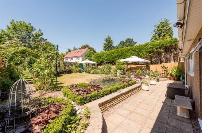 GARDEN With access via the dining room and kitchen breakfast room this beautifully maintained landscaped private rear garden has a patio area with separate seating area which would be perfect for