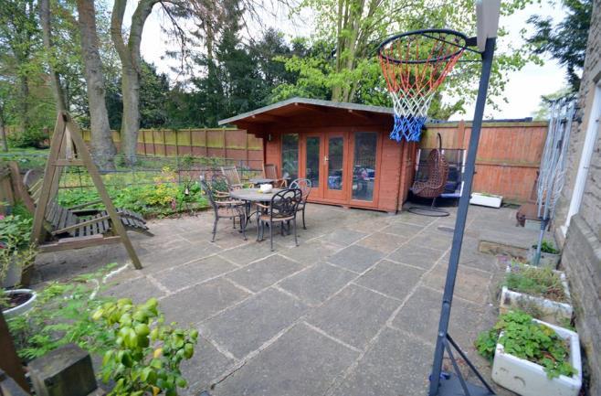 To the front of the property there is a large open area which has been paved, ideal for outdoor