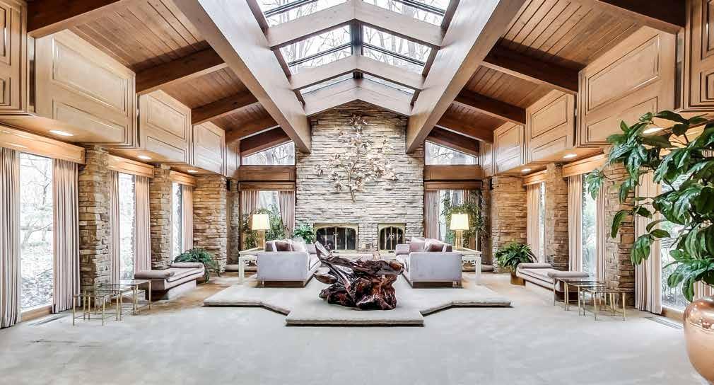 living room - Huge in scale, lined in stone, and boasting a wood-clad