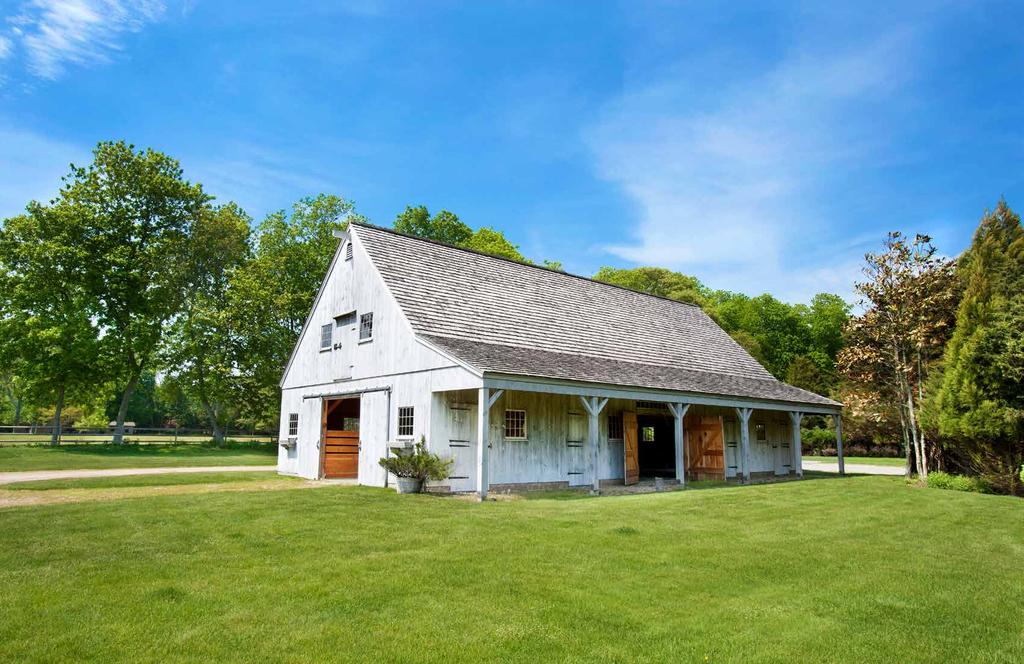 STONE WALLS, GRASSY PADDOCKS AND MULTIPLE BARNS OFFER ALLURING ACCENTS TO THIS