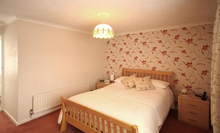 LOUNGE Rear aspect double glazed double doors to garden, coved ceiling, feature fireplace comprising, Timber surround,