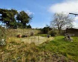 This garden is well screened from the road by leylandi hedging and gated pedestrian access.