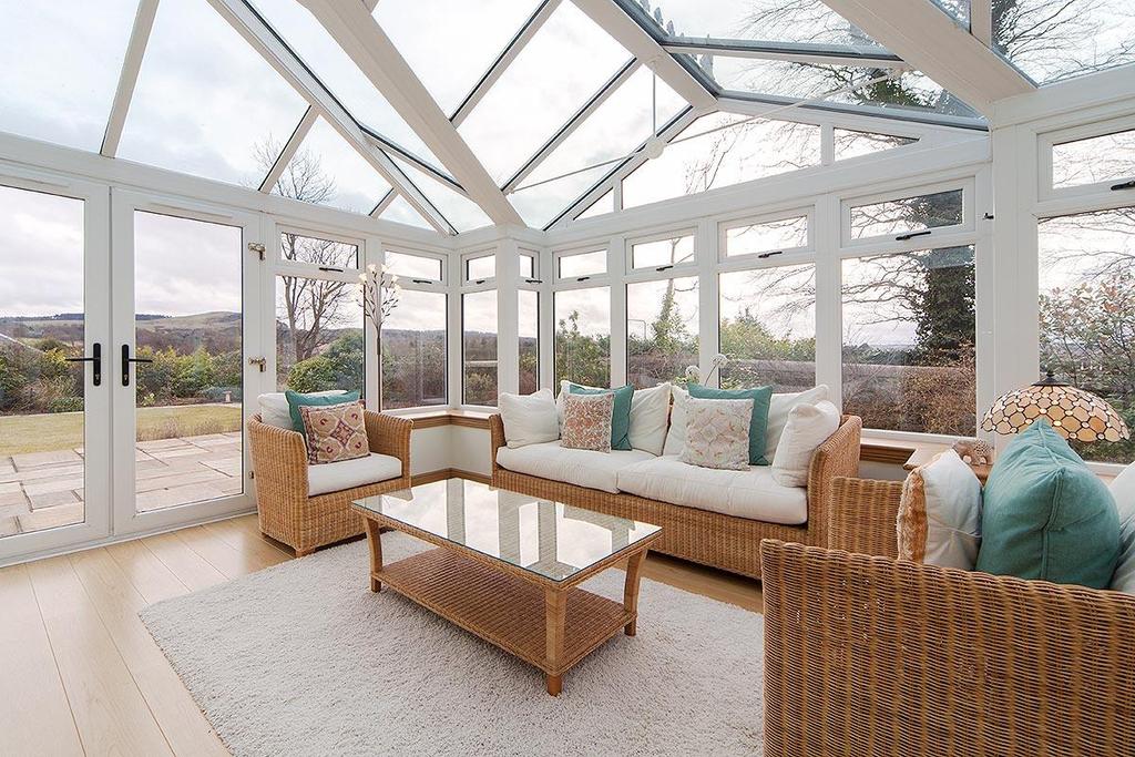 Two sitting rooms and a large conservatory make up the remainder of the downstairs space. The luxurious formal sittin g room is a warm, comfortable room with a surprise feature.
