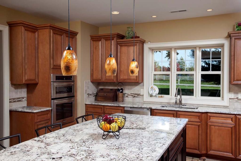 The new kitchen, which opens to the great room, features a 9 foot granite island centerpiece, high