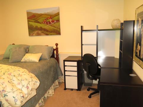 It is fully furnished with a double bed, desk, dresser and mini-refrigerator.
