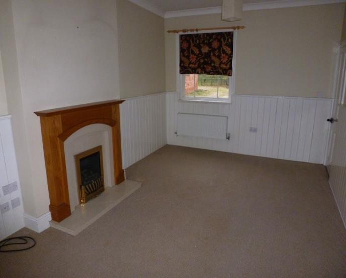 ACCOMMODATION ENTRANCE HALL: With understairs store. Central heating radiator. Internal doors giving access to: - LOUNGE: 18'7" x 10'8" (5.