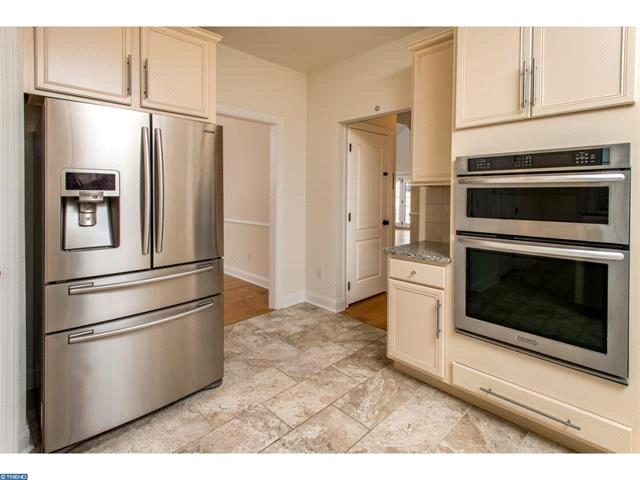 The gourmet kitchen features stainless steel appliances, granite countertops and breakfast nook.