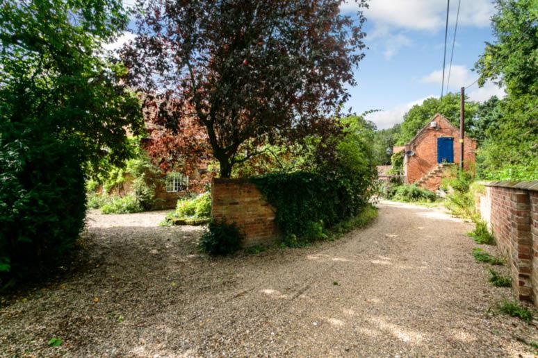 has mature well stocked private gardens also with access out to the central courtyard area. There are generous lawns with deep borders and a variety of mature trees and shrubs.