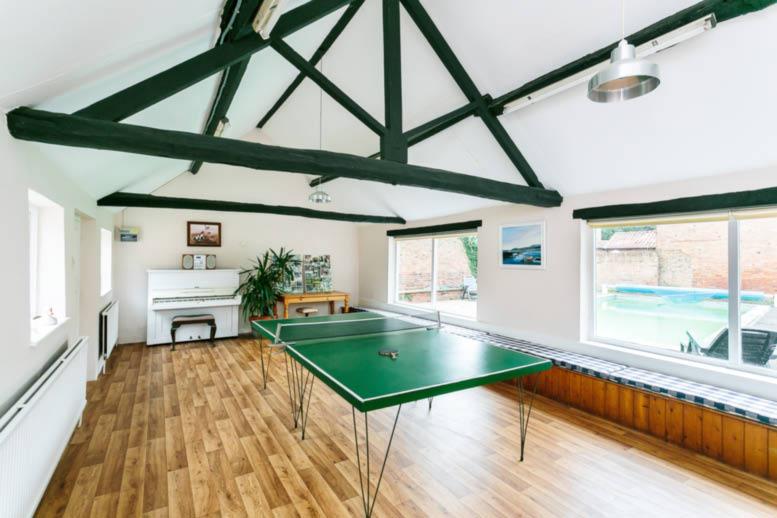 This is a substantial conversion of former agricultural buildings to offer a separate residential unit with accommodation on the ground floor, comprising a large sitting room with beamed ceiling and