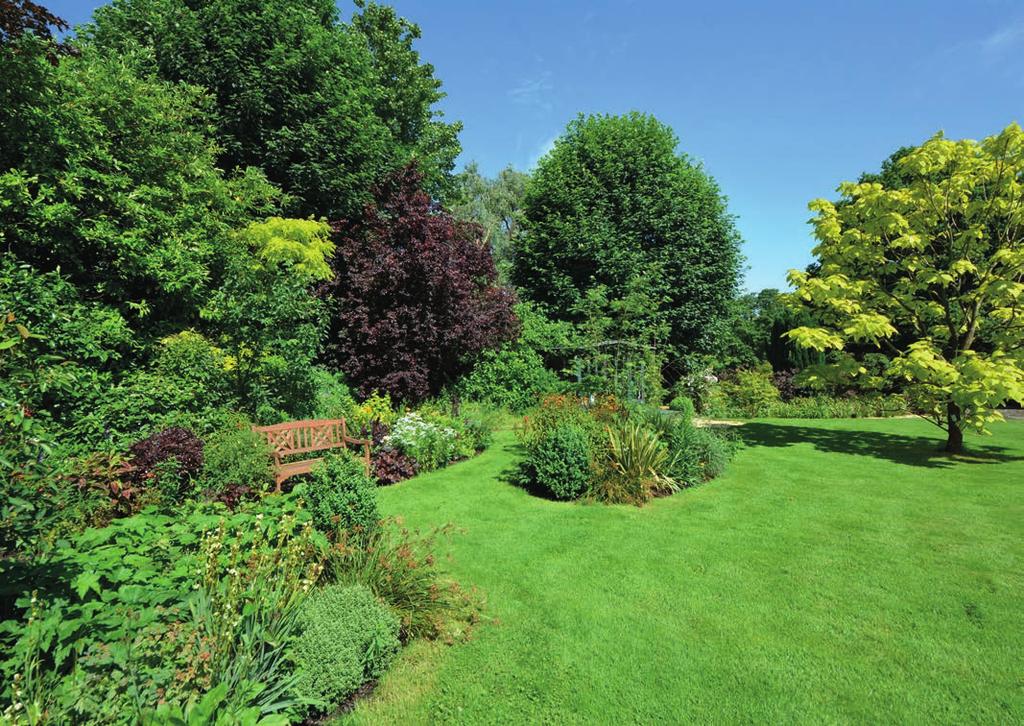 The lawns and gardens are delightful with a combination of formal planting areas abundantly stocked with a fabulous variety of flowers, shrubs and trees, whilst
