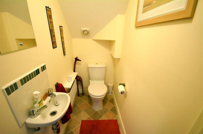 CLOAKROOM Cloakroom which is fitted with a WC and wash hand basin. MASTER BEDROOM 3.