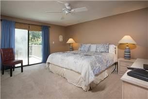 The master bedroom has a king bed, TV and private bathroom.